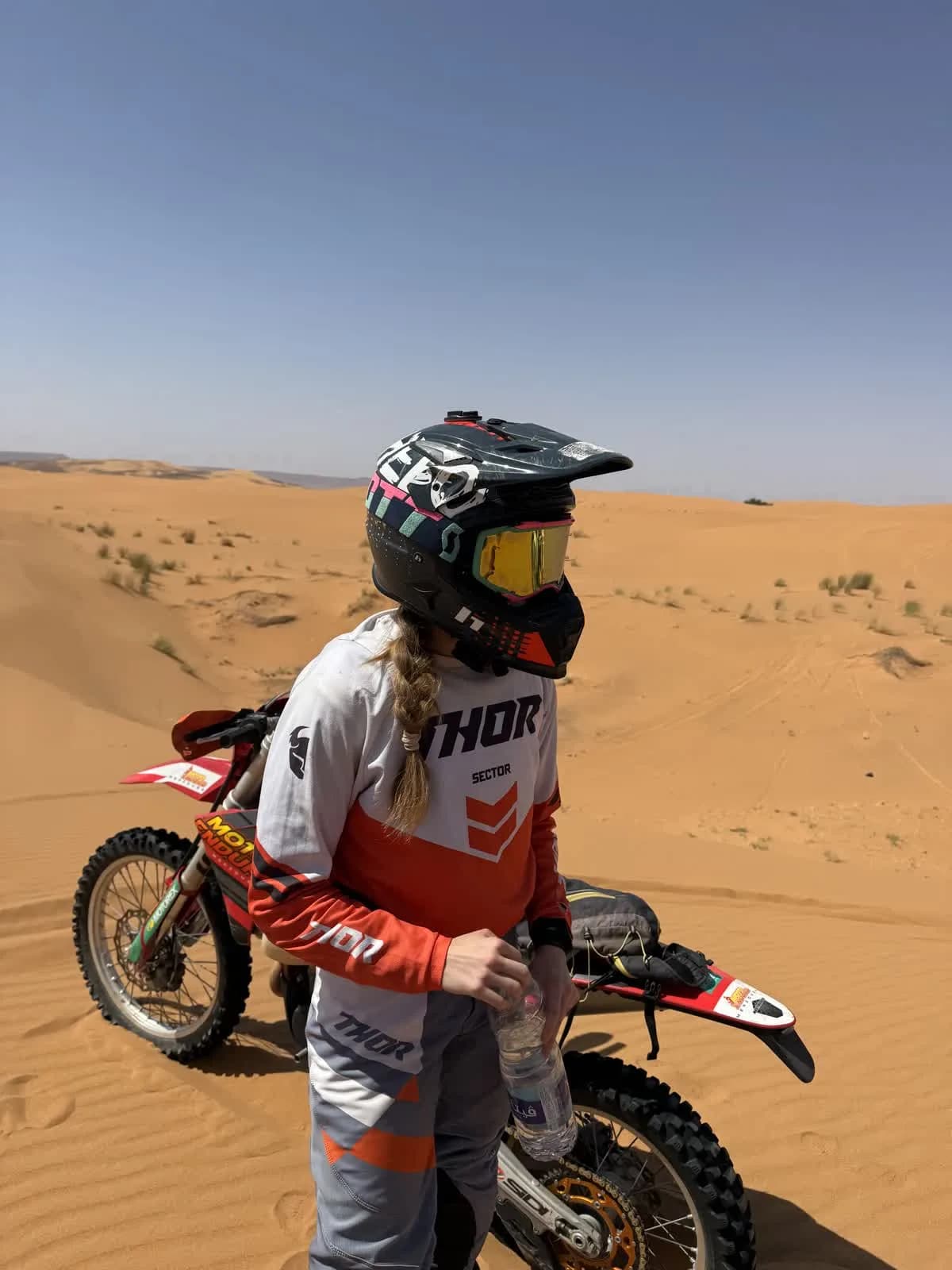 Dirt bike rider in desert dunes